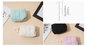 Close-up of quilted waffle texture coin purses in pastel colors with gold keychains