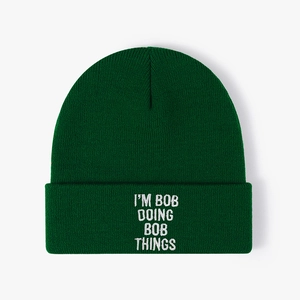 Dark green knitted beanie featuring I'M BOB DOING BOB THINGS white embroidered slogan