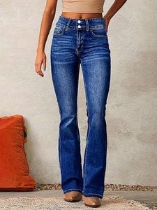 Detail view of high waist double-button design on retro blue flare jeans for women