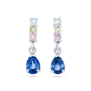 Detail of teardrop blue zircon earrings with multi-colored gemstones in silver setting