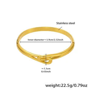 Detail view of gold stainless steel knot bangle with size and weight measurements