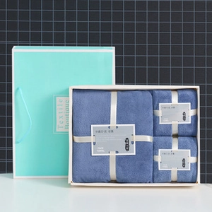 Detail of soft blue towel gift set in a luxury box with a matching blue carrying bag