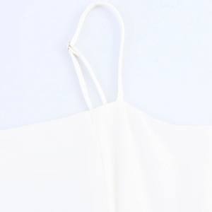 White sleeveless dress with adjustable thin shoulder straps and tropical palm tree prints