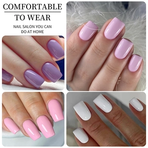 Detail of short press-on nails in lavender, pink, and white with a glossy salon finish