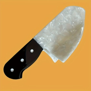 Halloween acrylic knife hair clip with white marble pattern and black handle on yellow background