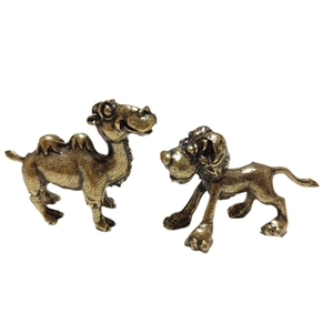 Antique brass miniature set featuring a stylized camel and curly-haired dog desk ornament