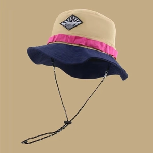 Detail of multi-color outdoor sun hat with adjustable windproof drawstring and woven patch