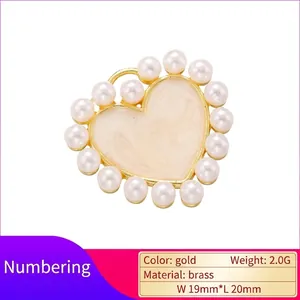 Elegant gold brass heart pendant with white pearls and marble texture enamel center