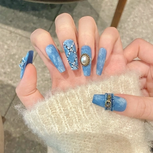 Denim blue press-on nails with retro cross, pearls and buckle on long trapezoid shape