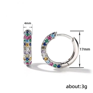Silver hoop earrings for women with multi-colored cubic zirconia stones on white background