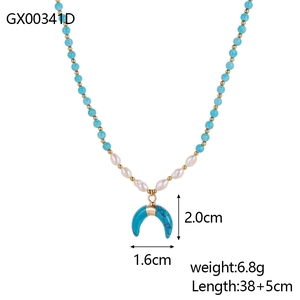 Detail view of bohemian necklace with blue stone beads and golden moon pendant