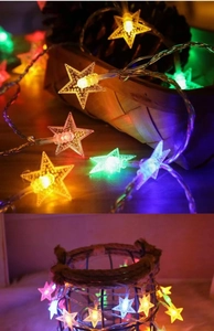 Macro detail of pentagram LED star string lights in a rustic home decor setting