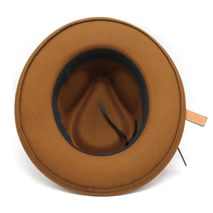 Detail of thick wool fedora inner lining with black sweatband and leather strap