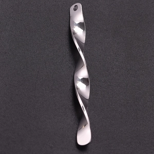 Macro view of polished 304 stainless steel spiral pendant with smooth chrome finish