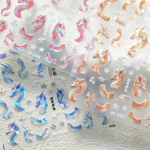 Detail of 5D holographic dragon nail art decals with iridescent finish and floral motifs