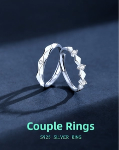 Macro detail of adjustable S925 silver couple rings with sparkling diamond accents