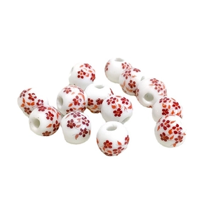 Polished white ceramic beads with red flower patterns for jewelry making and crafts
