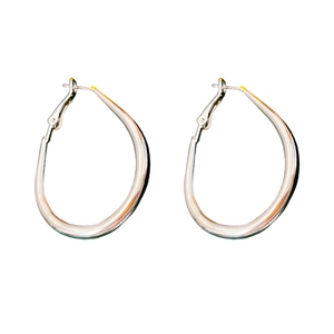 Minimalist silver geometric U-shaped drop earrings with a polished metallic finish on white