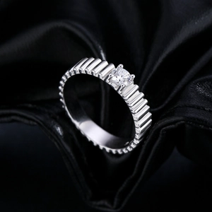 Polished S925 silver moissanite ring with a unique wavy texture on a black silk background