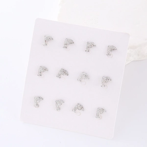 Set of six pairs of silver dolphin stud earrings featuring sparkling rhinestones on card