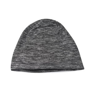 Detailed close-up of melange gray knitted beanie fabric showing the breathable texture