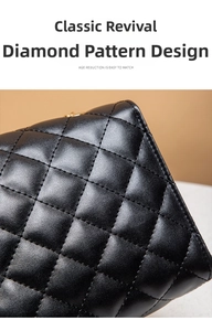 Close-up of black lychee grain leather with diamond quilted stitching and gold hardware