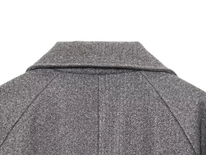 Close-up detail of the grey wool coat collar showing premium stitching and fabric texture