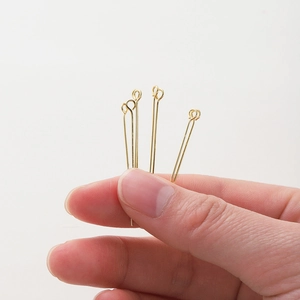 Close-up of 18K gold plated eye pins for handmade DIY jewelry and accessory making