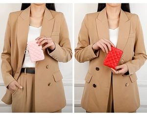 Detailed close-up of quilted PU leather coin purses in pink and red with key rings