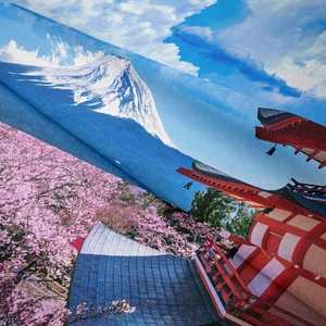 Detail view of woven Mount Fuji tapestry showing fabric texture and cherry blossom print