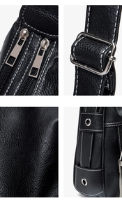 Detail view of black leather saddle bag featuring white stitching and silver hardware