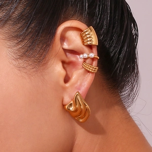 Irregular geometric 18K gold plated stainless steel ear cuffs set with pearls on model