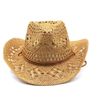 Detail of hand-woven straw cowboy hat featuring hollow mesh texture and brown decorative cord
