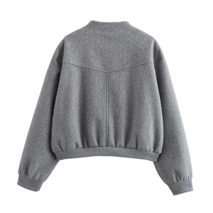 Back view of a grey short tweed jacket showing ribbed collar and hem detail