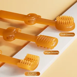 Pet silicone toothbrush set with three amber orange brush heads and monkey design
