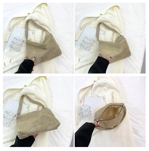 Detail shot of golden rhinestone hobo bag with top zipper and spacious inner compartment