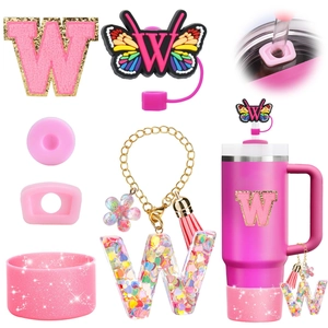 Pink 40oz stainless steel cup with glitter letter W charm and butterfly straw topper