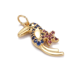 Detailed view of a gold-plated toucan pendant set with colorful zirconia stones