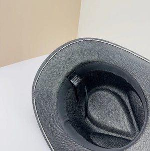 Detail view of the interior gray fedora hat with sweatband and cotton polyester label
