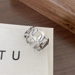 Detailed macro shot of S925 sterling silver chain link ring with vintage finish textures