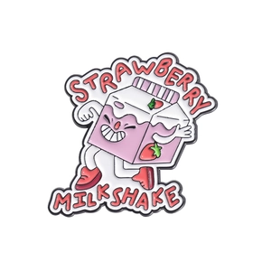 Detailed macro view of a cute pink strawberry milkshake enamel pin with a cartoon smiley face