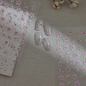3D cherry blossom nail stickers with pink and white embossed flowers on clear false nails
