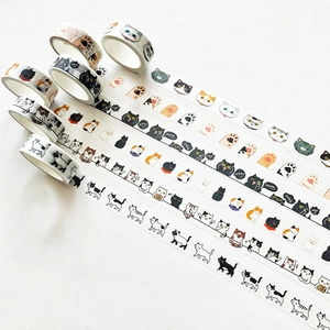 Close-up of cute cartoon cat washi tapes with colorful kitten patterns for journaling