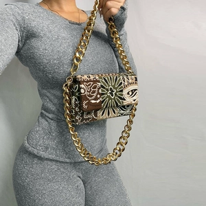 Vintage bandana patchwork chain bag with gold hardware shown on a female model