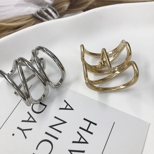 Minimalist geometric metal hair clips in gold and silver finish with hollow design