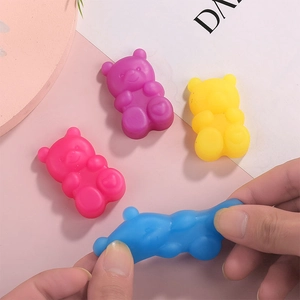 Cute gummy bear squishy toys in four colors with stretchable soft texture for stress relief