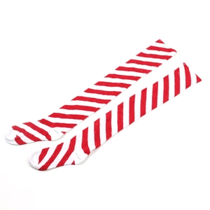 Detailed knit texture of red and white diagonal striped over-the-knee festive socks