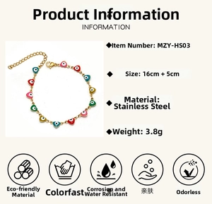 Detail view of colorful heart evil eye charms on a golden stainless steel chain link