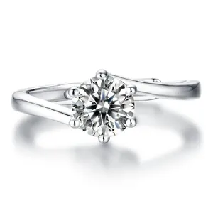 Close-up of sparkling round-cut zircon ring with elegant six-prong crossover band