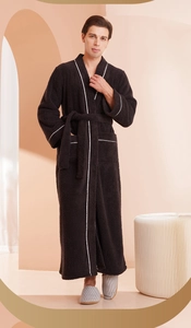Detailed close-up of plush thick bathrobe with white piping and waist tie for men